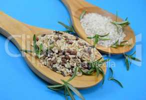 Different types of rice in wooden spoons