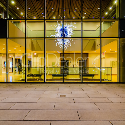 building interior with glass art piece suspended