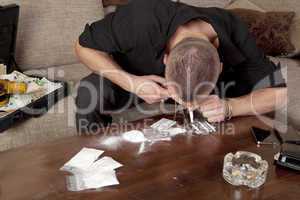 man taking a line cocaine
