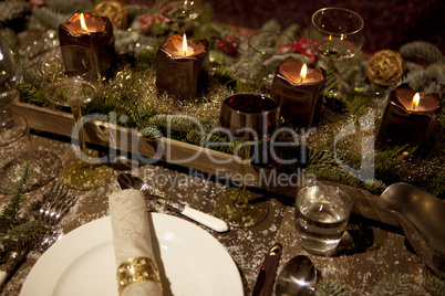 christmas laid table in the candlelight