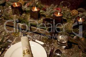 christmas laid table in the candlelight