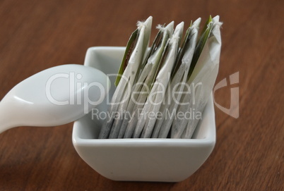 Tea bags in a small white bowl