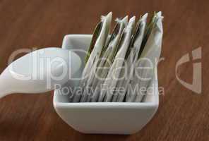 Tea bags in a small white bowl