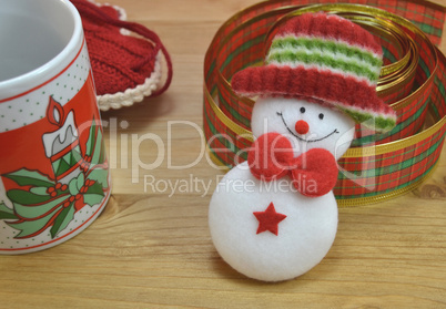 Mug with Christmas decor and santa claus toy