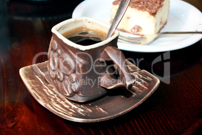 cup of coffee and portion of cake