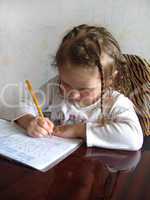 girl learning her home tasks