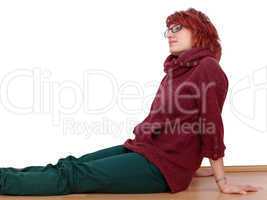 young woman sitting relaxed on the floor