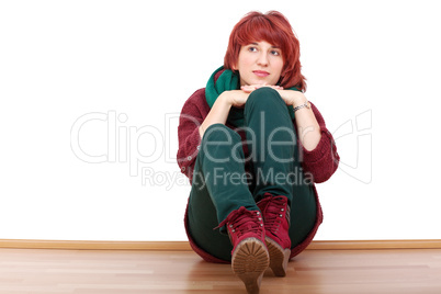 young woman sitting relaxed on the floor