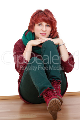 young woman sitting relaxed on the floor