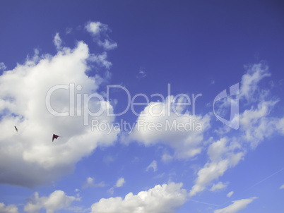 blue sky with clouds and kites