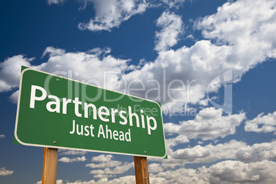 partnership green road sign over clouds and sky