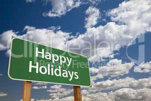 happy holidays green road sign over clouds and sky