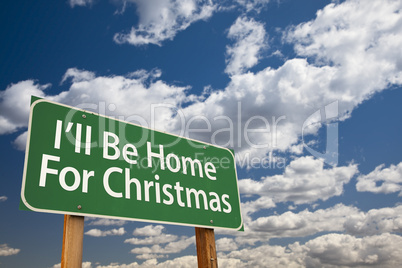 i'll be home for christmas green road sign over sky
