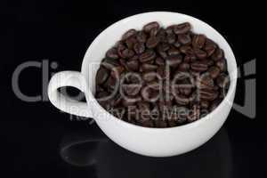 cup of full roast coffee beans