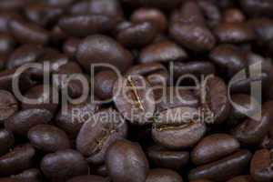 background of dark full roasted coffee beans