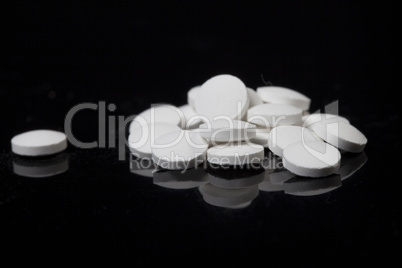 small round pills, made of chemical substances