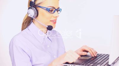 Beautiful telesales lady at her computer