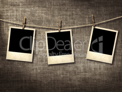 polaroid style photographs hanging on a clothesline