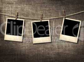 polaroid style photographs hanging on a clothesline