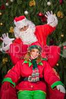 santa clause with elf helper xmas armchair