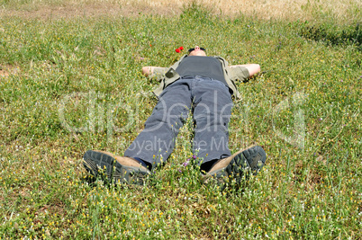 man lying on grass