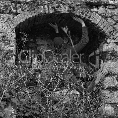 obscured figures in arched structure
