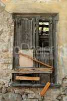 boarded up old window shutter