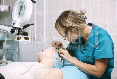 beautician in a skin clinic with a patient