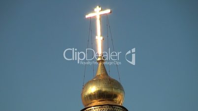 Golden cross on temple