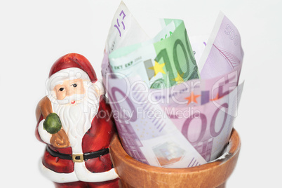 Santa claus with a bowl full of money