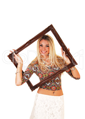 girl looking trough picture frame.