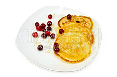 flapjacks with cranberry and honey in a plate