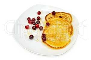 flapjacks with cranberry and honey in a plate
