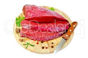 meat beef with parsley on a round board