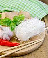 noodles rice thin with a napkin on the board