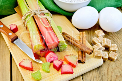 rhubarb with sugar and eggs on the board