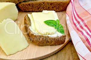 Sandwich with cheese suluguni and butter on board