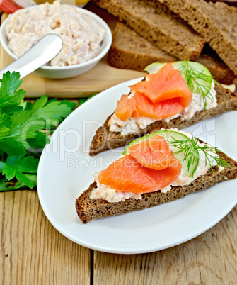 Sandwich with cream and salmon in the dish with dill