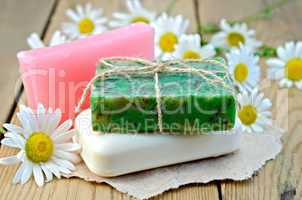 Soap homemade with chamomile on a board