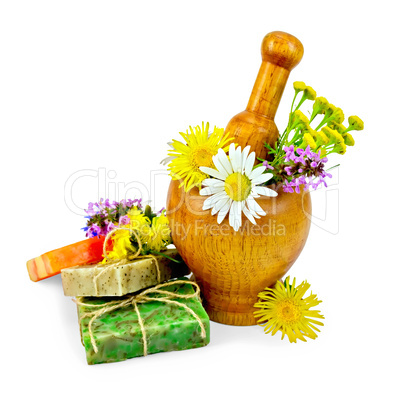 Soap homemade with wildflowers in a mortar