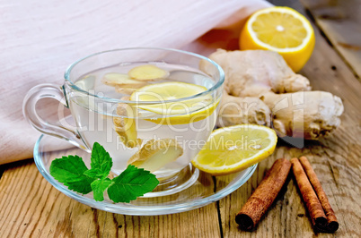 Tea ginger with lemon and cinnamon on board