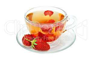 Tea with strawberries in a glass cup