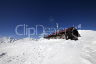 wooden hotel at snowy mountains