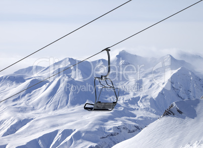 chair lifts and off-piste slope in fog
