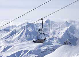 chair lifts and off-piste slope in fog