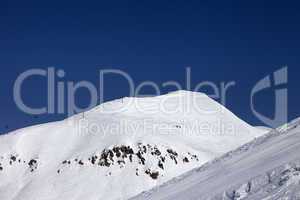 ski slope and ropeway at nice winter day