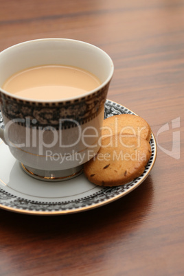 a cup of tea with biscuits