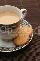 a cup of tea with biscuits