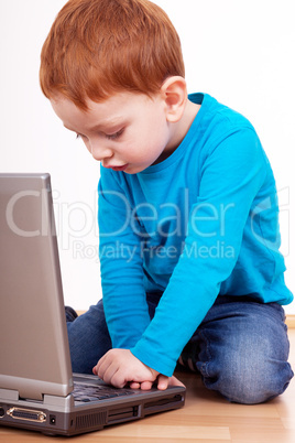 child while exploring on laptop