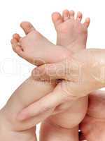 mother hands holding baby feet